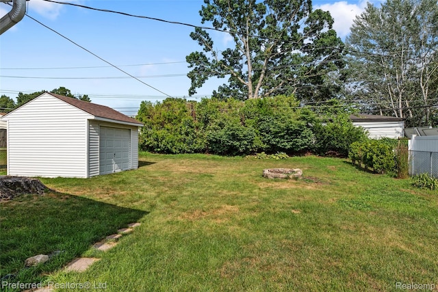 839 Judith St, Westland, MI 48186 - view of yard featuring an outbuilding and a garage