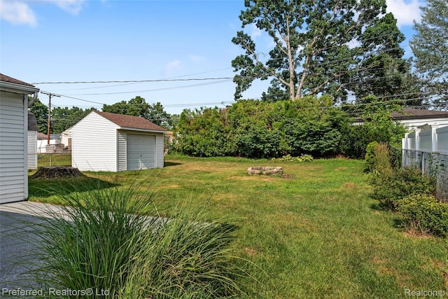 839 Judith St, Westland, MI 48186 - view of yard featuring an outbuilding and a detached garage