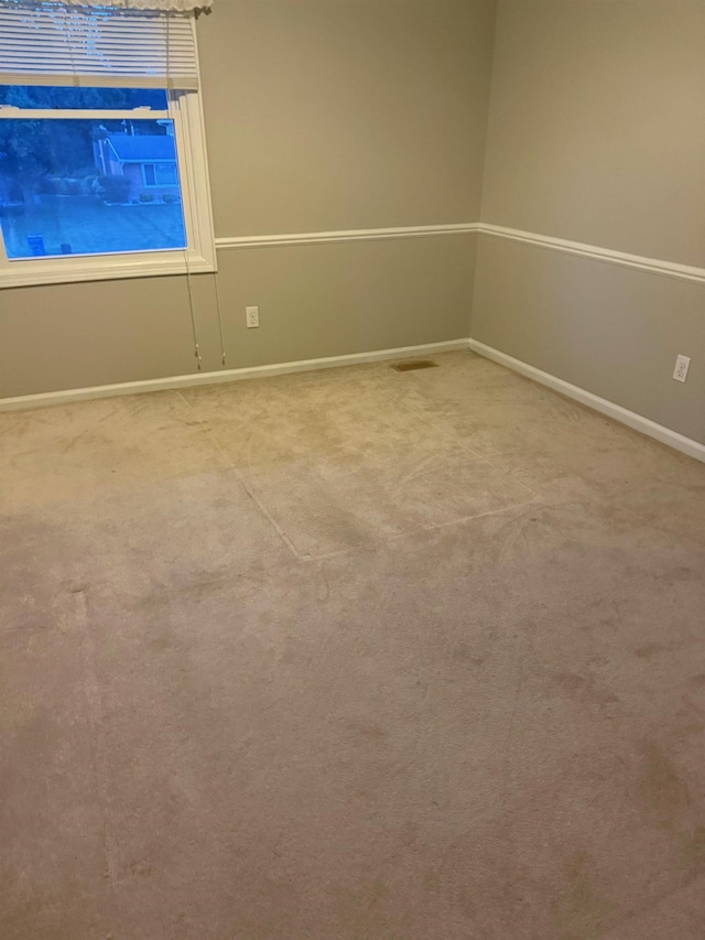 12806 Via Catherina Dr, Grand Blanc, MI 48439 - spare room featuring carpet flooring and baseboards