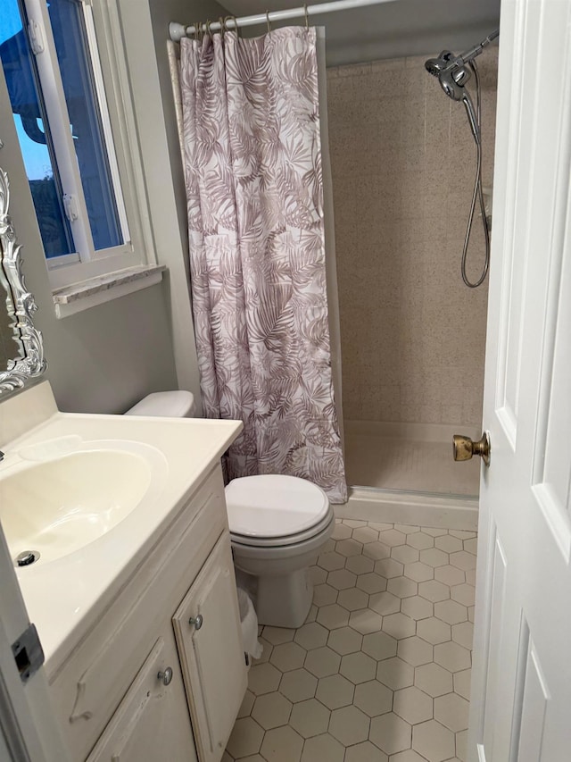 12806 Via Catherina Dr, Grand Blanc, MI 48439 - full bathroom with vanity, a shower with curtain, and tile patterned flooring