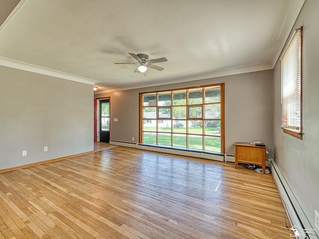 855 Mildred Ave, Temperance, MI 48182 - unfurnished room featuring a baseboard heating unit, ornamental molding, a ceiling fan, and light wood finished floors