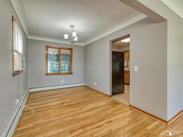 855 Mildred Ave, Temperance, MI 48182 - spare room with a baseboard heating unit, healthy amount of natural light, light wood-type flooring, and ornamental molding