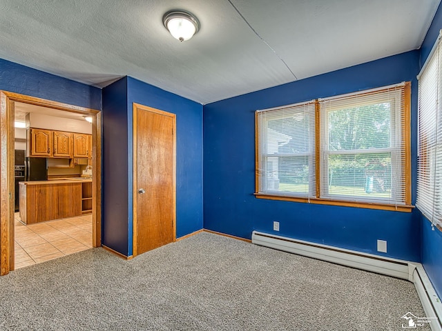 855 Mildred Ave, Temperance, MI 48182 - unfurnished bedroom with baseboard heating, carpet, a closet, a baseboard radiator, and multiple windows