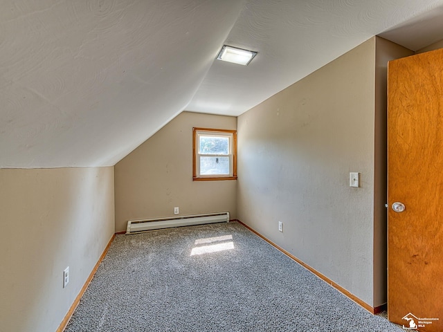 855 Mildred Ave, Temperance, MI 48182 - additional living space with baseboard heating, lofted ceiling, and carpet floors