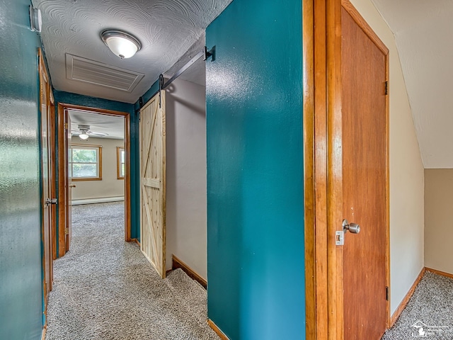 855 Mildred Ave, Temperance, MI 48182 - hallway featuring carpet floors, baseboard heating, and a barn door