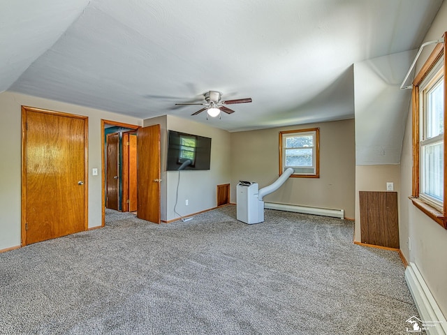 855 Mildred Ave, Temperance, MI 48182 - spare room featuring a baseboard heating unit, carpet flooring, and a ceiling fan