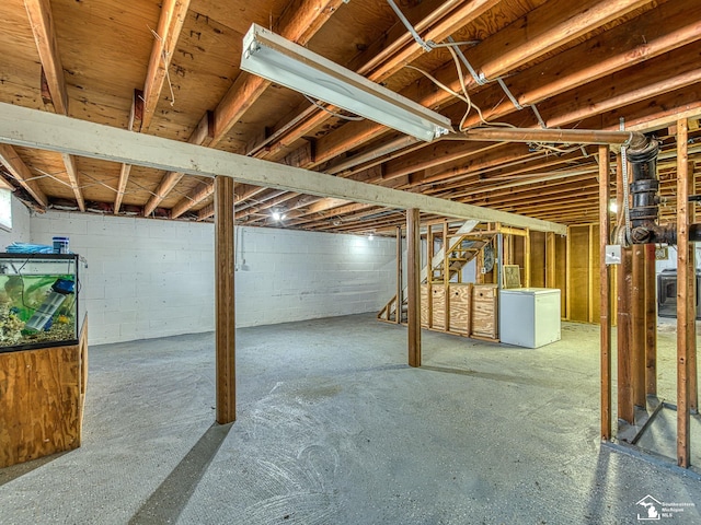 855 Mildred Ave, Temperance, MI 48182 - unfinished basement featuring fridge, stairs, and concrete block wall