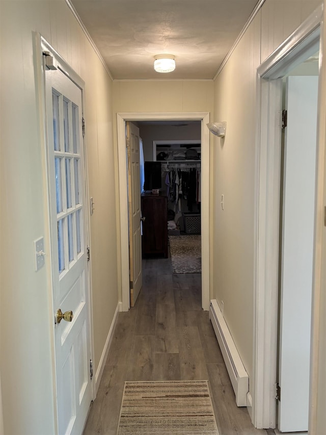 4442 Congdon Dr, Williamston, MI 48895 - corridor featuring a baseboard radiator, ornamental molding, and wood finished floors