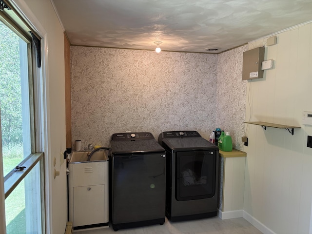 4442 Congdon Dr, Williamston, MI 48895 - laundry room featuring washing machine and clothes dryer, healthy amount of natural light, and wallpapered walls