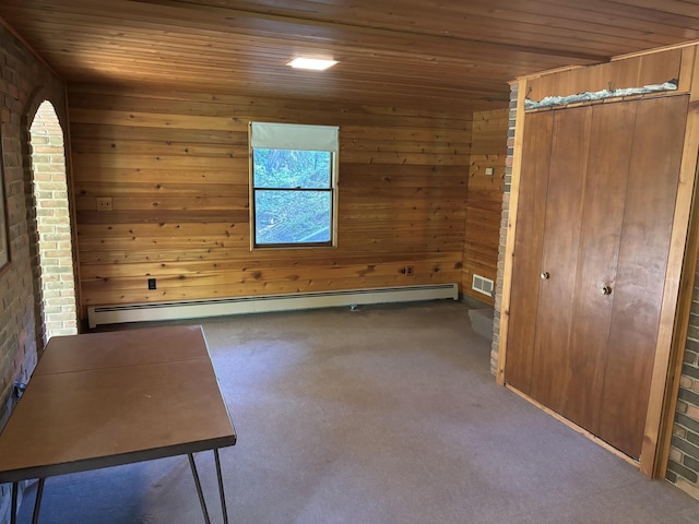 4442 Congdon Dr, Williamston, MI 48895 - unfurnished bedroom with wooden ceiling, a baseboard radiator, wood walls, and carpet