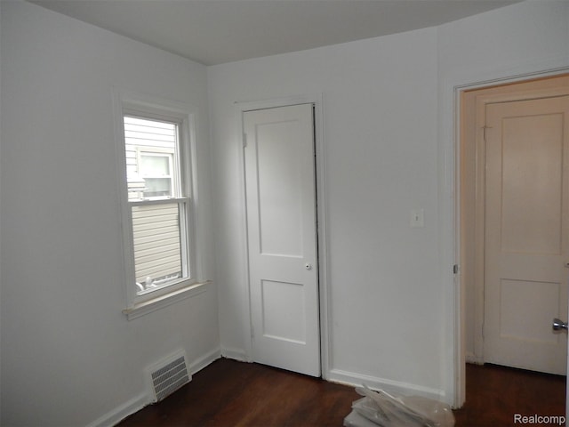 3161 Fort Park Blvd, Lincoln Park, MI 48146 - unfurnished bedroom with dark wood-type flooring and baseboards