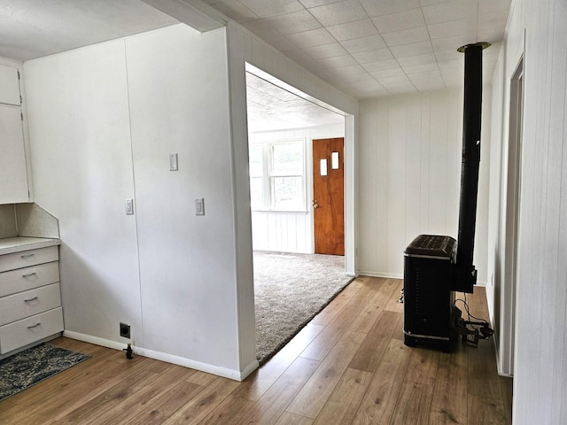 109 W Woodrow St, Fremont, MI 49412 - entryway featuring wood-type flooring and a wood stove
