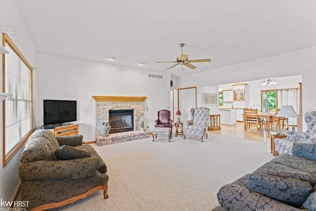 5130 Highpoint Dr, Swartz Creek, MI 48473 - carpeted living area with a fireplace and ceiling fan