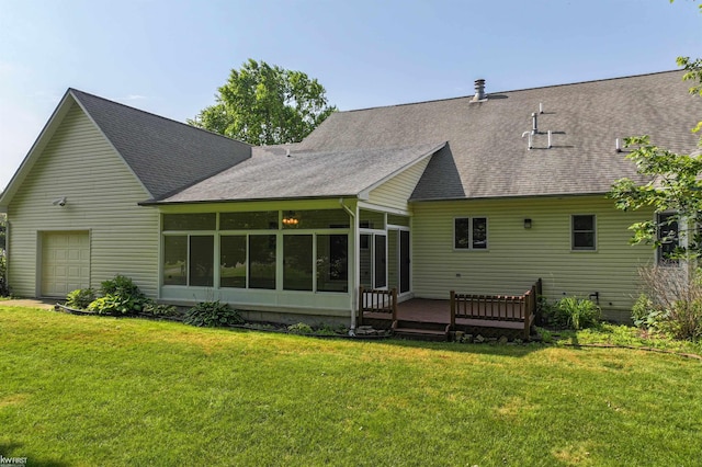 5130 Highpoint Dr, Swartz Creek, MI 48473 - back of property featuring a sunroom, a shingled roof, a garage, a deck, and a yard