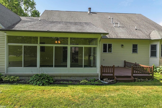 5130 Highpoint Dr, Swartz Creek, MI 48473 - back of house featuring a sunroom, a wooden deck, a yard, and a shingled roof