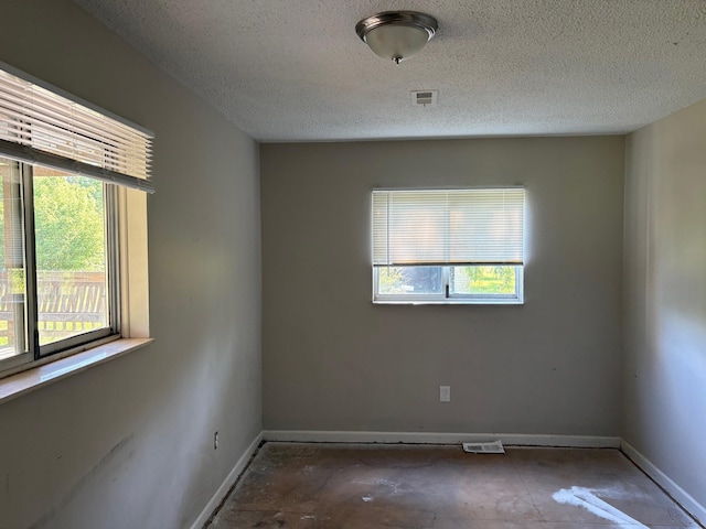 4299 N Belsay Rd, Flint, MI 48506 - unfurnished room featuring a textured ceiling and baseboards