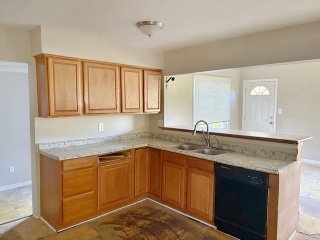 4299 N Belsay Rd, Flint, MI 48506 - kitchen with dishwasher, a peninsula, light countertops, and brown cabinets