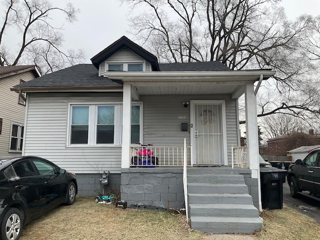 13564 Tuller St, Detroit, MI 48238 - bungalow-style house featuring covered porch and roof with shingles