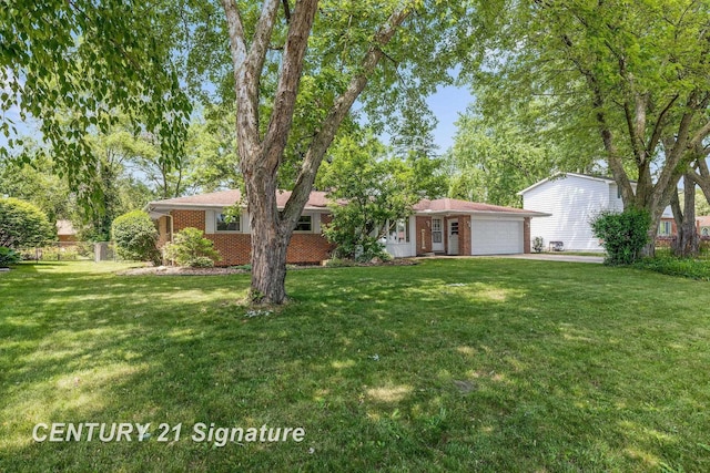 9 Wiltse Ct, Saginaw, MI 48603 - ranch-style home featuring a garage, brick siding, and driveway