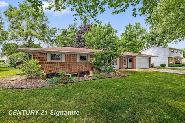 9 Wiltse Ct, Saginaw, MI 48603 - view of front facade with a garage, concrete driveway, a front lawn, and brick siding