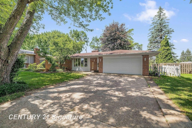 9 Wiltse Ct, Saginaw, MI 48603 - ranch-style house featuring concrete driveway, an attached garage, brick siding, and a chimney