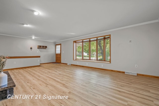 9 Wiltse Ct, Saginaw, MI 48603 - unfurnished living room featuring crown molding, light wood-style floors, and a wood stove