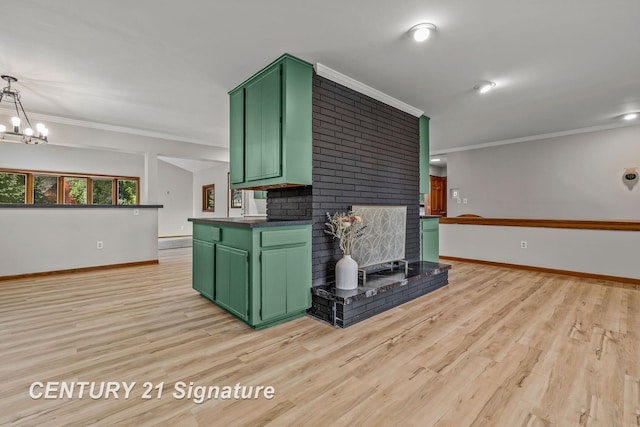 9 Wiltse Ct, Saginaw, MI 48603 - kitchen featuring green cabinets, ornamental molding, light wood-style floors, a chandelier, and a fireplace