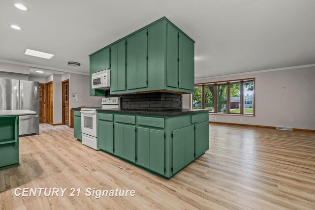 9 Wiltse Ct, Saginaw, MI 48603 - kitchen with white appliances, ornamental molding, light wood-style floors, recessed lighting, and tasteful backsplash