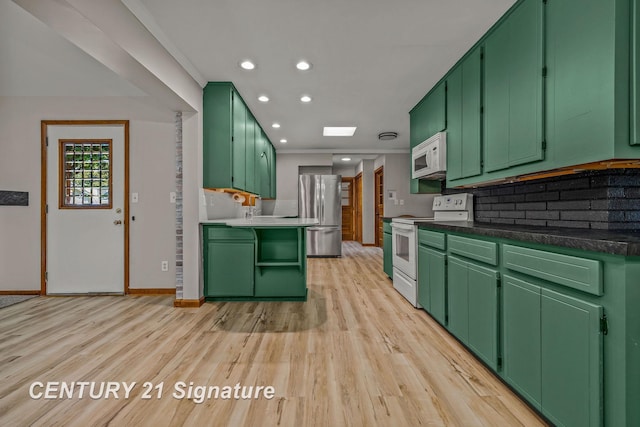 9 Wiltse Ct, Saginaw, MI 48603 - kitchen featuring white appliances, light wood-type flooring, green cabinets, and recessed lighting