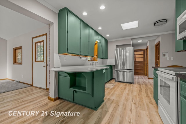 9 Wiltse Ct, Saginaw, MI 48603 - kitchen featuring green cabinets, white appliances, light wood-type flooring, light countertops, and recessed lighting