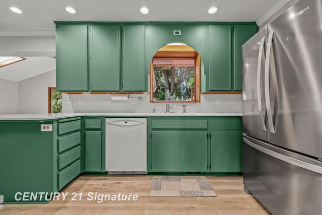 9 Wiltse Ct, Saginaw, MI 48603 - kitchen with freestanding refrigerator, white dishwasher, a peninsula, light countertops, and recessed lighting