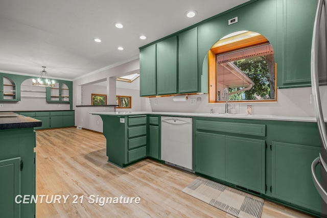 9 Wiltse Ct, Saginaw, MI 48603 - kitchen with white dishwasher, green cabinets, a peninsula, a chandelier, and ornamental molding
