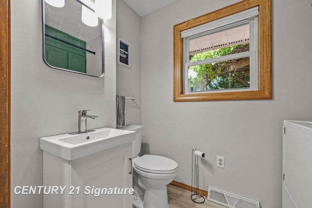 9 Wiltse Ct, Saginaw, MI 48603 - half bath with vanity and wood finished floors