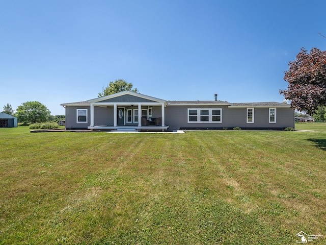 8955 Grafton Rd, Newport, MI 48166 - rear view of property with a lawn