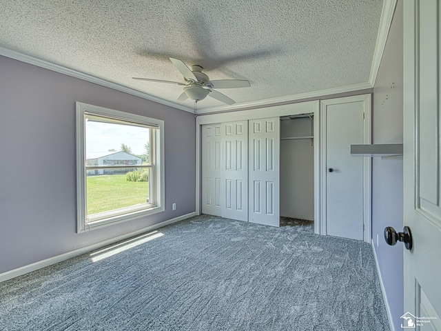 8955 Grafton Rd, Newport, MI 48166 - unfurnished bedroom with ornamental molding, carpet floors, a textured ceiling, a ceiling fan, and a closet