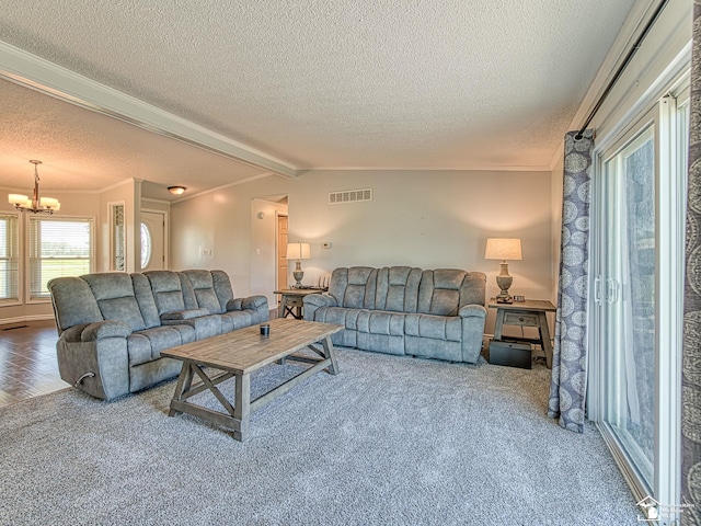 8955 Grafton Rd, Newport, MI 48166 - carpeted living room featuring a chandelier, a textured ceiling, and crown molding