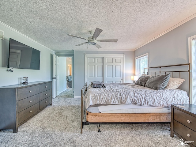 8955 Grafton Rd, Newport, MI 48166 - bedroom featuring crown molding, light colored carpet, a textured ceiling, a closet, and ceiling fan