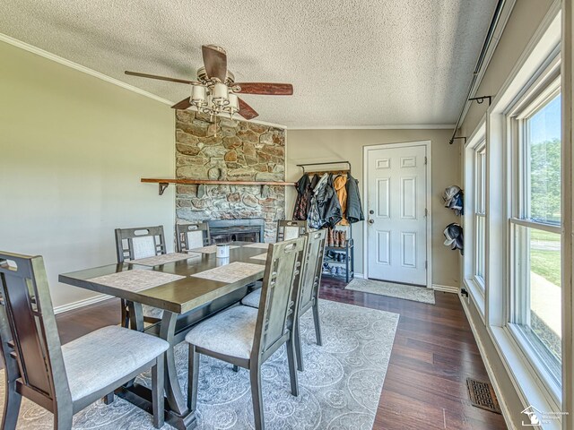 8955 Grafton Rd, Newport, MI 48166 - dining area featuring ornamental molding, a textured ceiling, plenty of natural light, ceiling fan, and wood finished floors