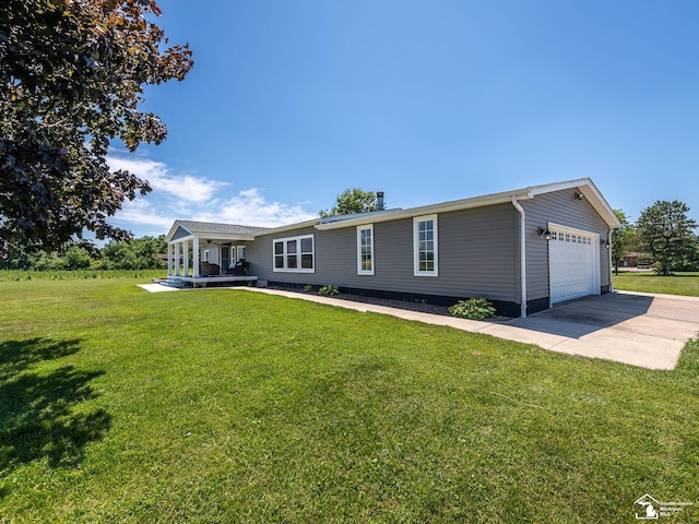 8955 Grafton Rd, Newport, MI 48166 - ranch-style home with a front yard and concrete driveway