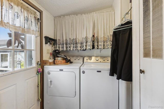 4591 Swaffer Rd, Millington, MI 48746 - laundry room with independent washer and dryer, a heating unit, and a textured ceiling