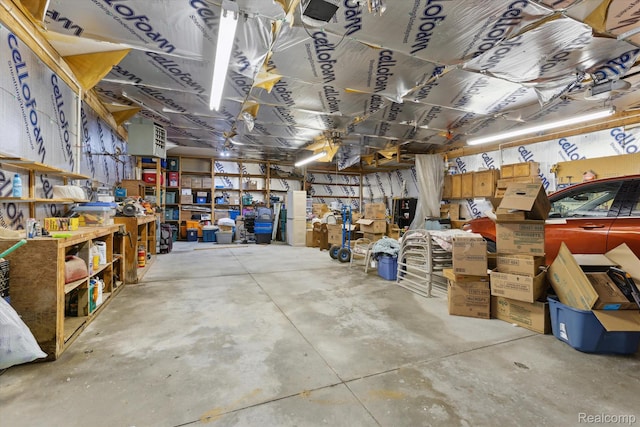 4591 Swaffer Rd, Millington, MI 48746 - garage featuring a workshop area