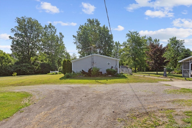 4591 Swaffer Rd, Millington, MI 48746 - view of side of home featuring a lawn
