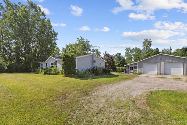 4591 Swaffer Rd, Millington, MI 48746 - view of front of property with dirt driveway, a detached garage, and a front lawn