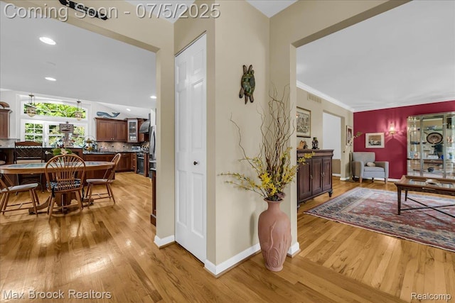 2511 Birch Harbor Ln, West Bloomfield, MI 48324 - hallway featuring light wood finished floors, recessed lighting, and crown molding