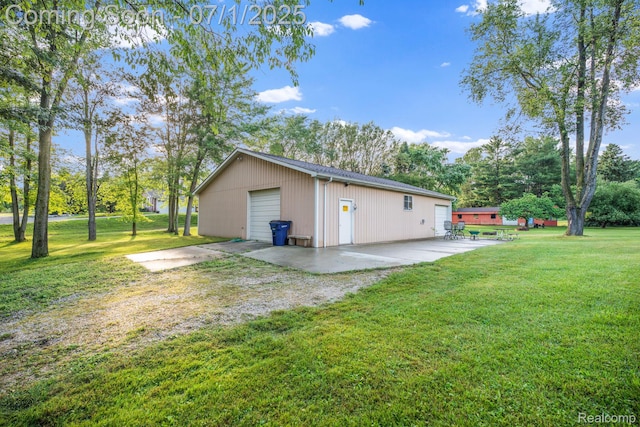 945 E Gunn Rd, Rochester, MI 48306 - rear view of house featuring an outbuilding, a detached garage, and a yard