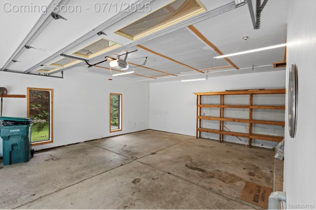945 E Gunn Rd, Rochester, MI 48306 - garage with a garage door opener and freestanding refrigerator