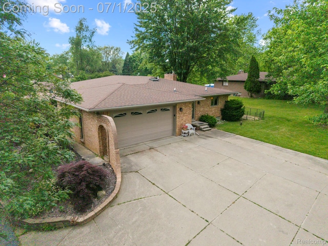 945 E Gunn Rd, Rochester, MI 48306 - view of front of property with a front lawn, brick siding, an attached garage, concrete driveway, and roof with shingles