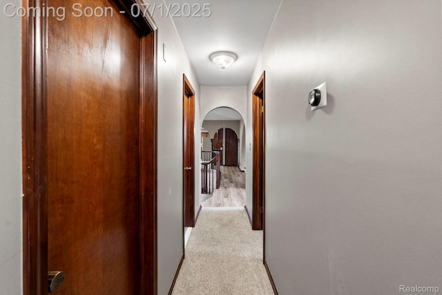 945 E Gunn Rd, Rochester, MI 48306 - hallway with arched walkways and carpet flooring