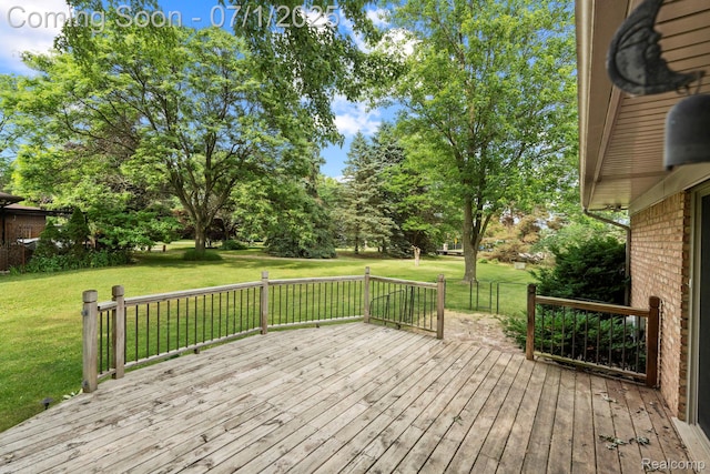 945 E Gunn Rd, Rochester, MI 48306 - wooden terrace with a lawn and view of wooded area