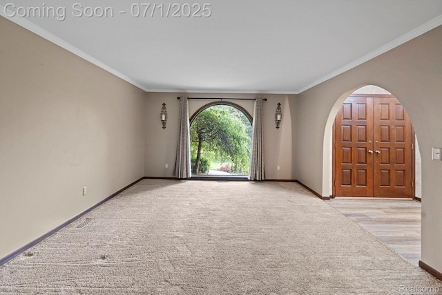 945 E Gunn Rd, Rochester, MI 48306 - carpeted empty room with ornamental molding and arched walkways